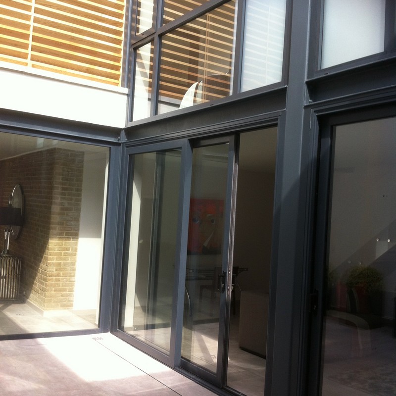 Anthracite aluminium sliding patio doors fitted in Esher