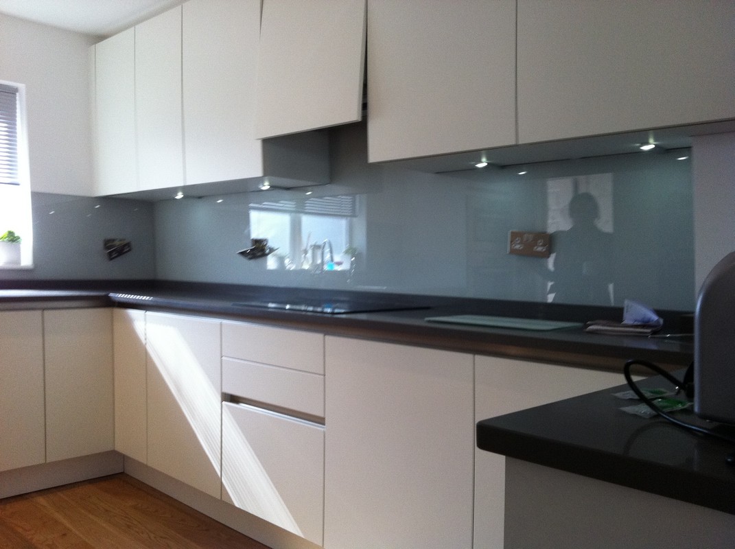 Grey glass kitchen splashback with LED lighting in Esher