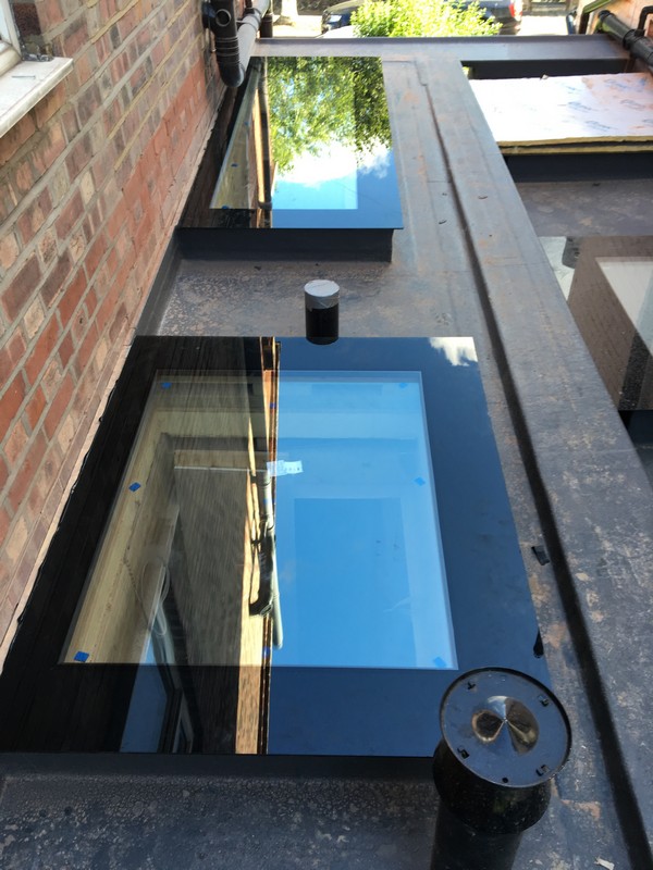 Multiple flat roof skylights on extension in Esher